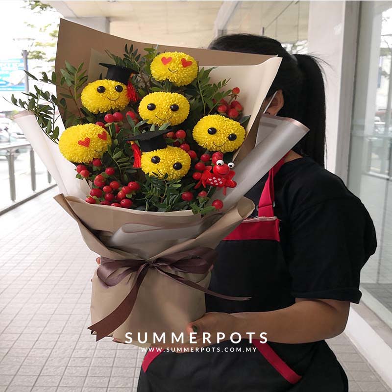 An Adorable Smiley Ping Pong Bouquet by Summer Pots, one of the top florist in KL, to brighten up graduation day of your beloved friends and family!